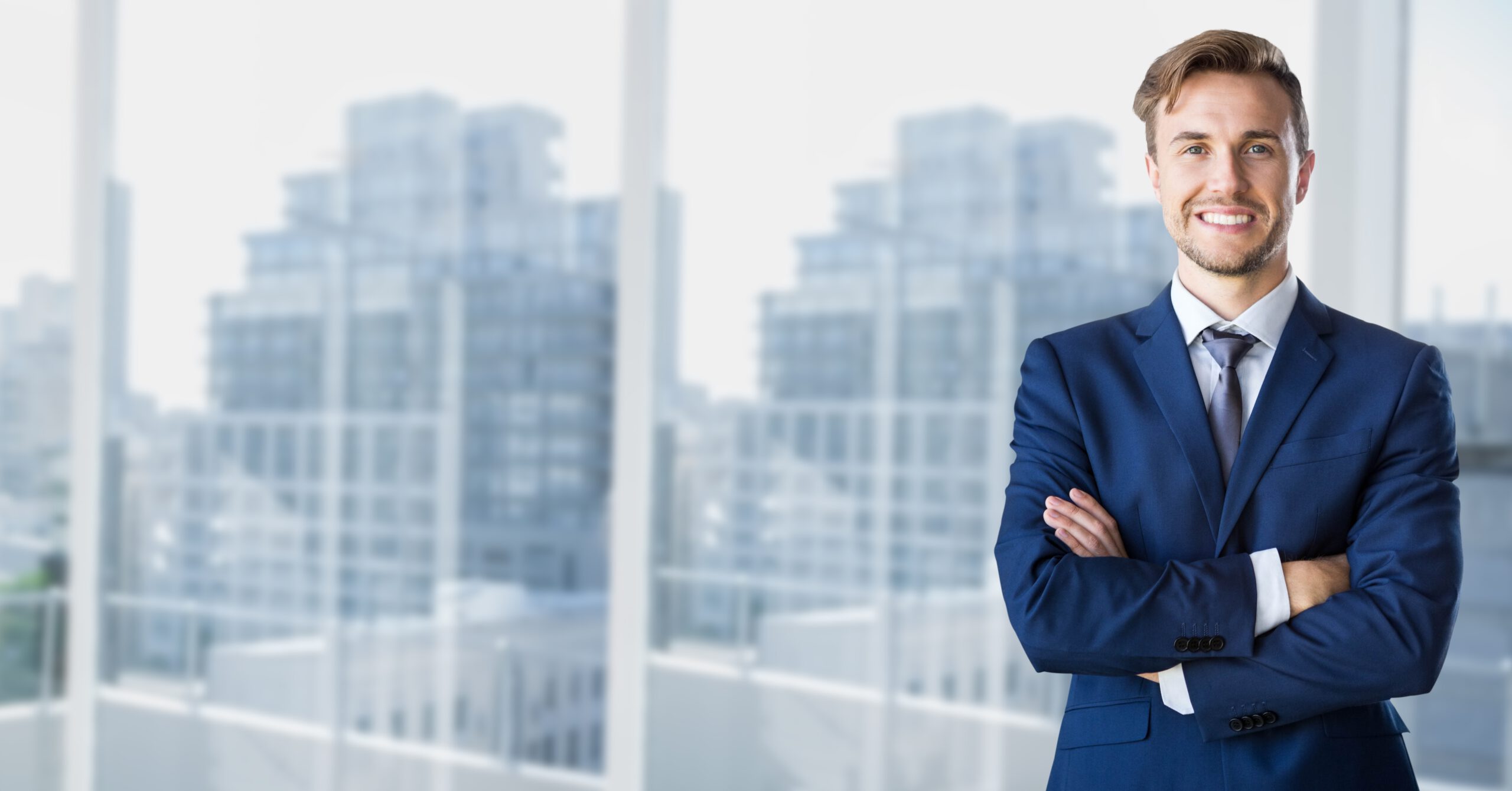 Businessman standing with arms crossed